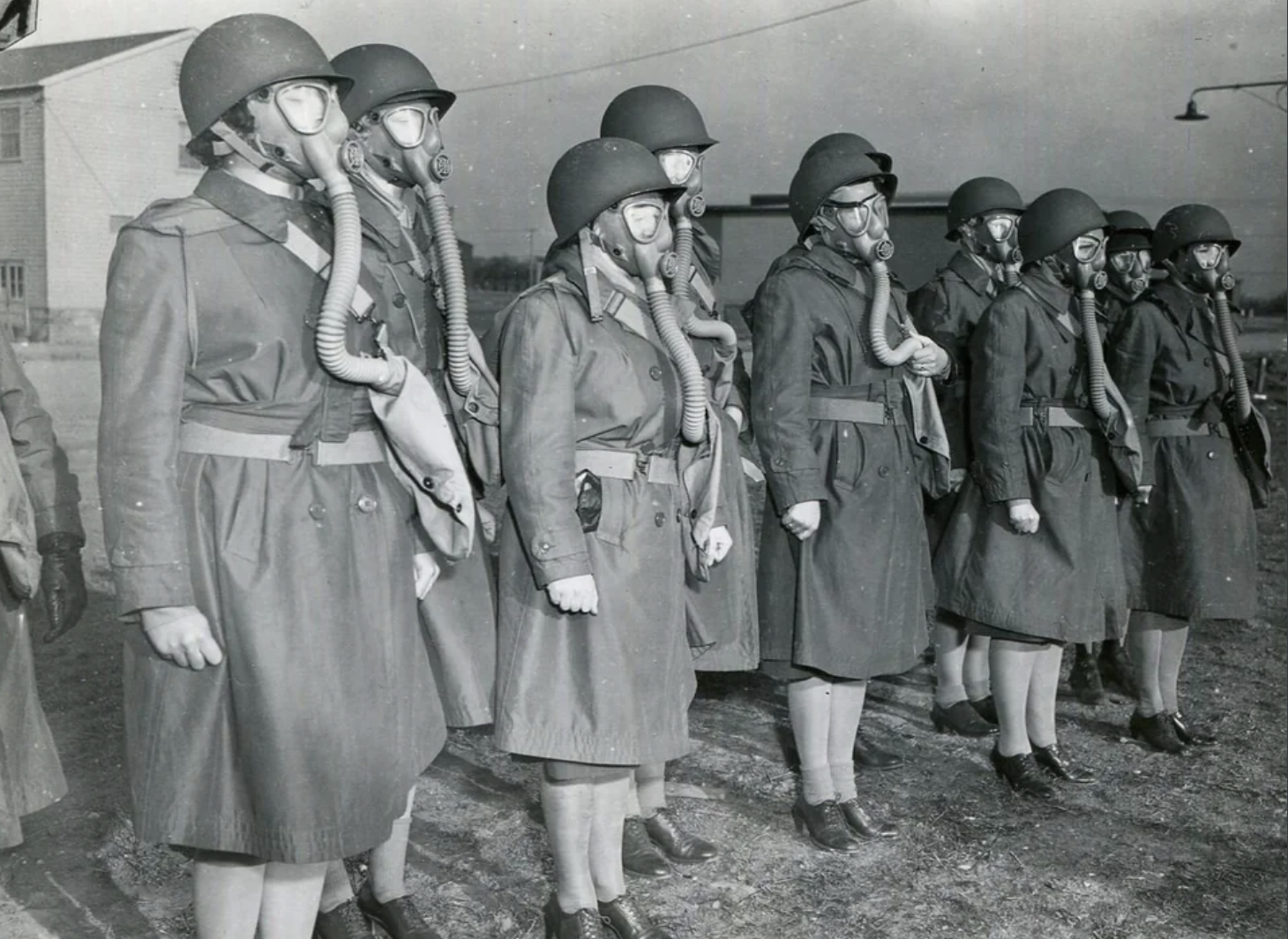 Soldiers in the Women's Army Auxiliary Corps (WAAC), wearing gas masks during training in Daytona Beach, just prior to sailing for Europe in November 1942.