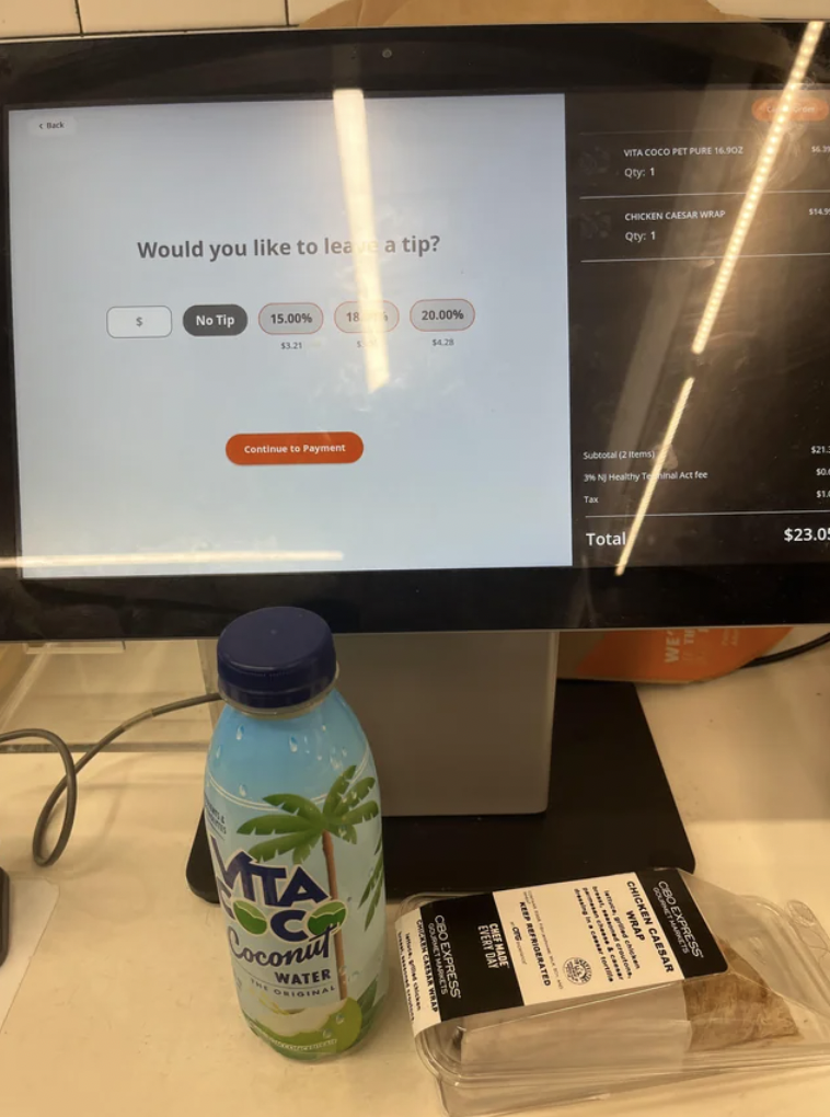 self checkout $40 - Would you to le a tip? No Tip 15.00% Ta C Cocon Water 26.00% Total $23.0