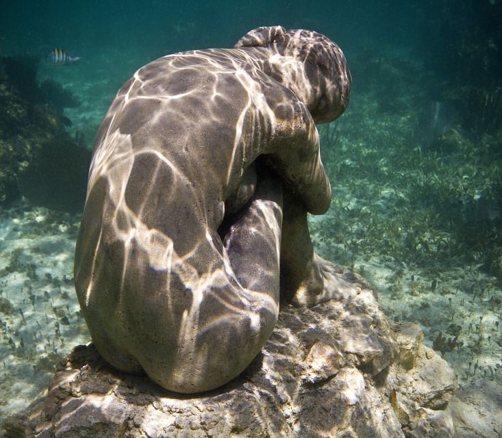 No Turning Back by Jason deCaires Taylor portrays a lone woman located just below the sea's surface.