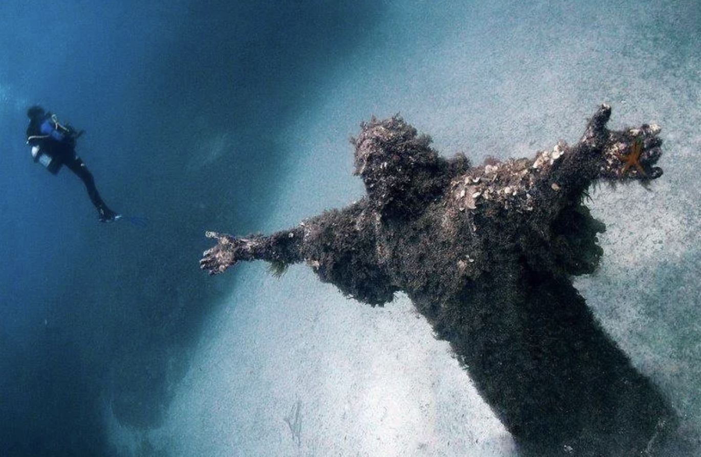 Underwater statue of Jesus on the sea bed in Malta.