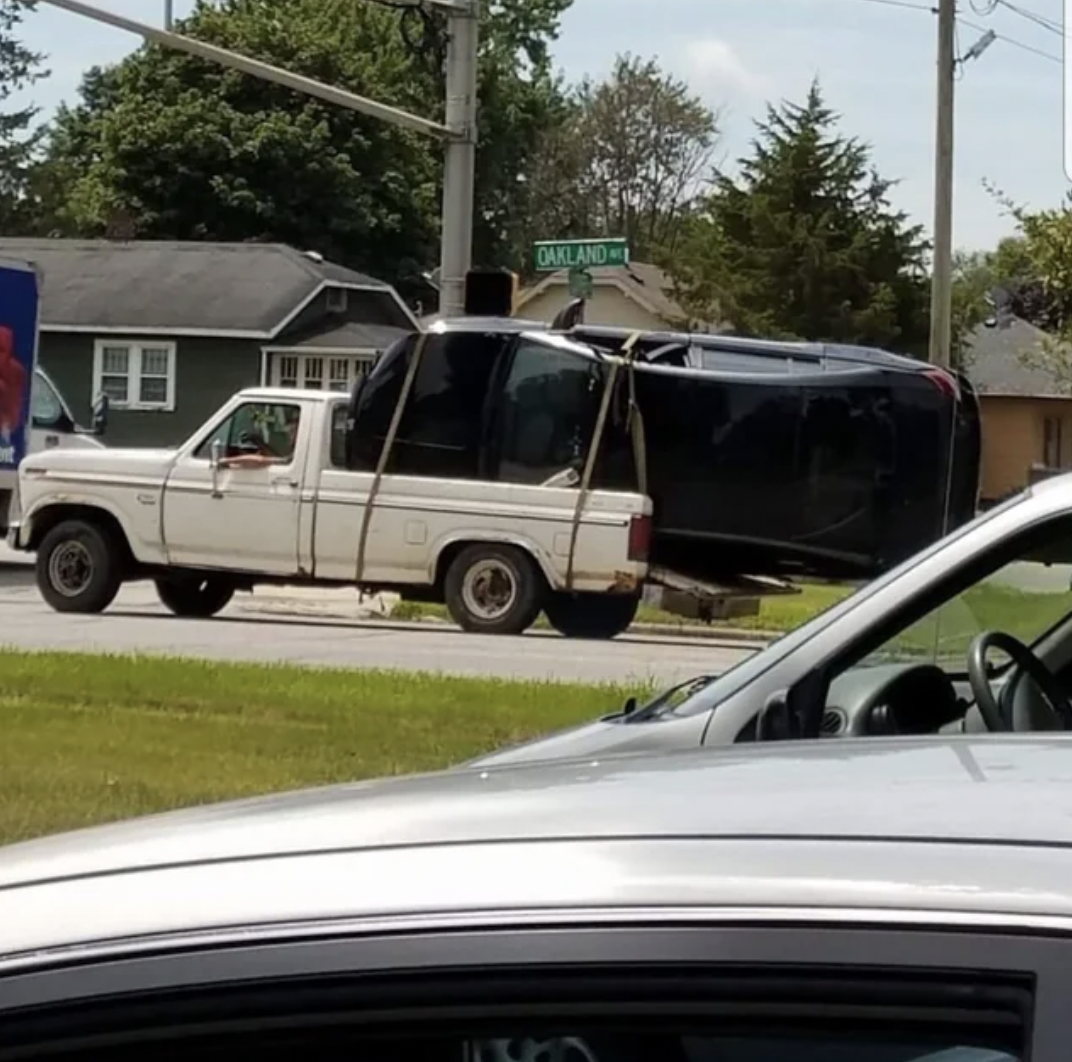 car in truck bed - Oakland