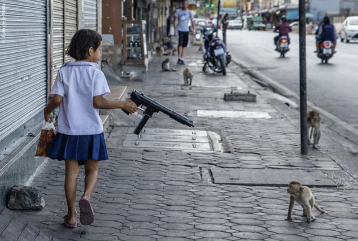 On her way home, a younger girl uses an airsoft machine gun to avoid being attacked by monkeys.