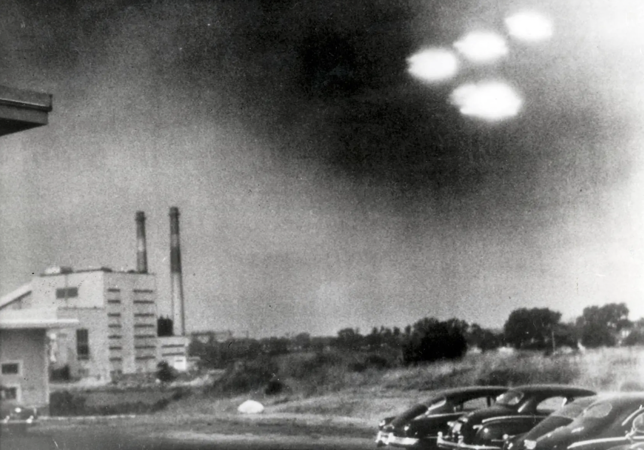 This picture, taken through the window of a laboratory by a 21-year-old U.S. coastguard, shows four unidentified flying objects as bright lights in the sky on Aug. 3, 1952, in Salem, Mass.