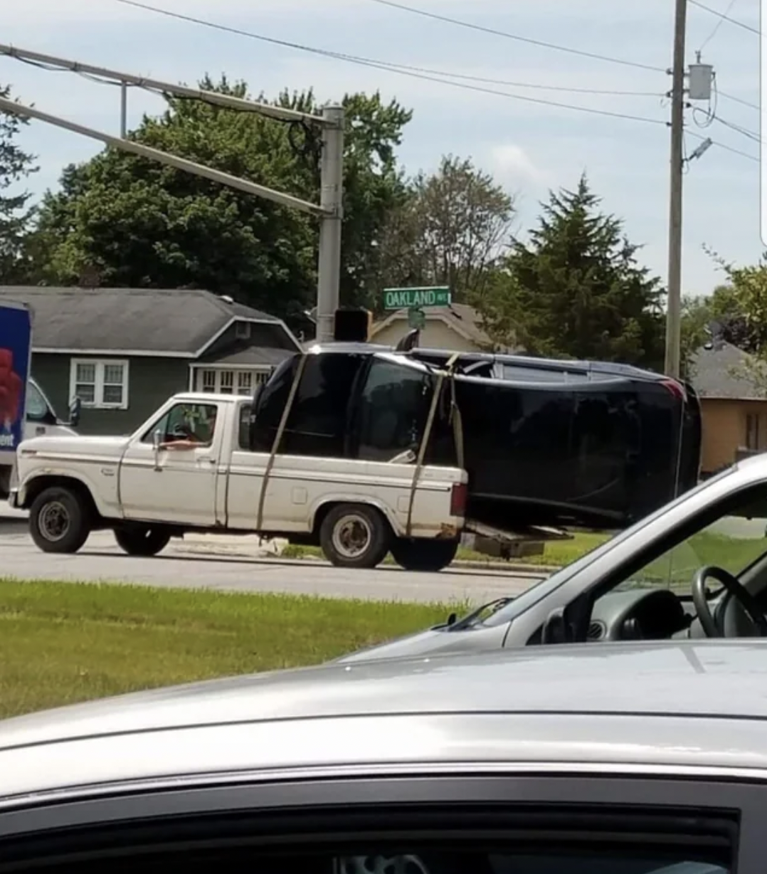 car in truck bed - Oakland