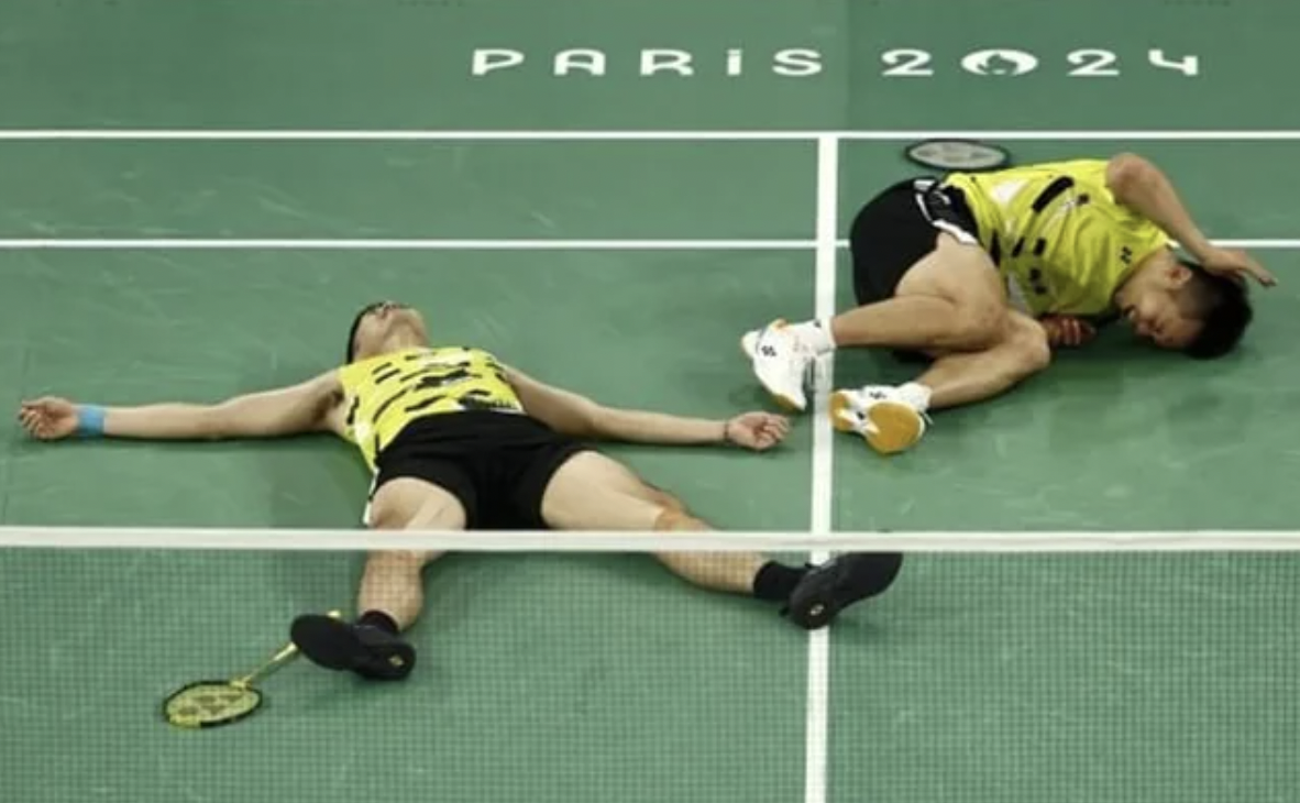 Taiwan Badminton players exhausted after beating China for the gold.