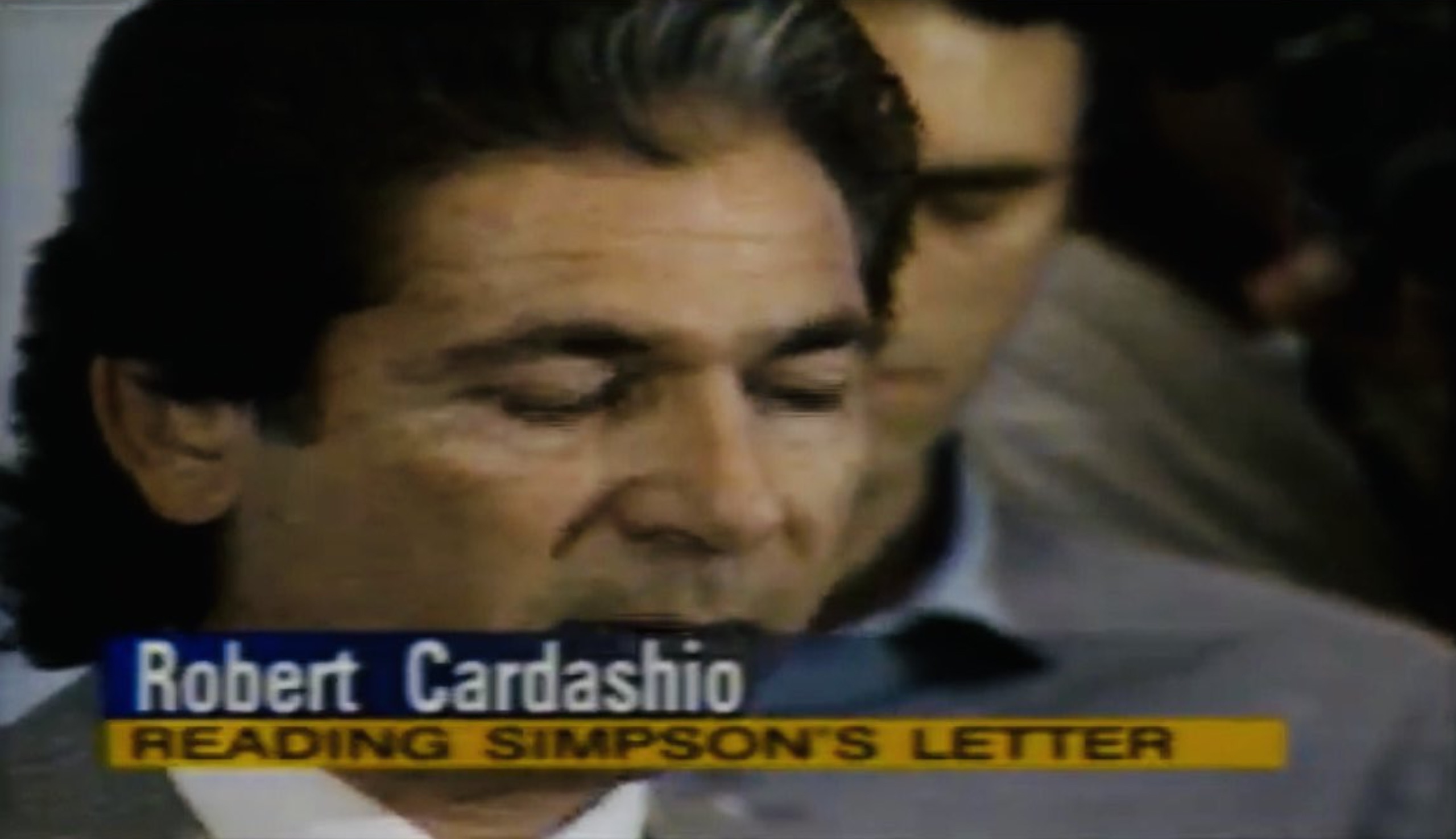 photo caption - Robert Cardashio Reading Simpson'S Letter