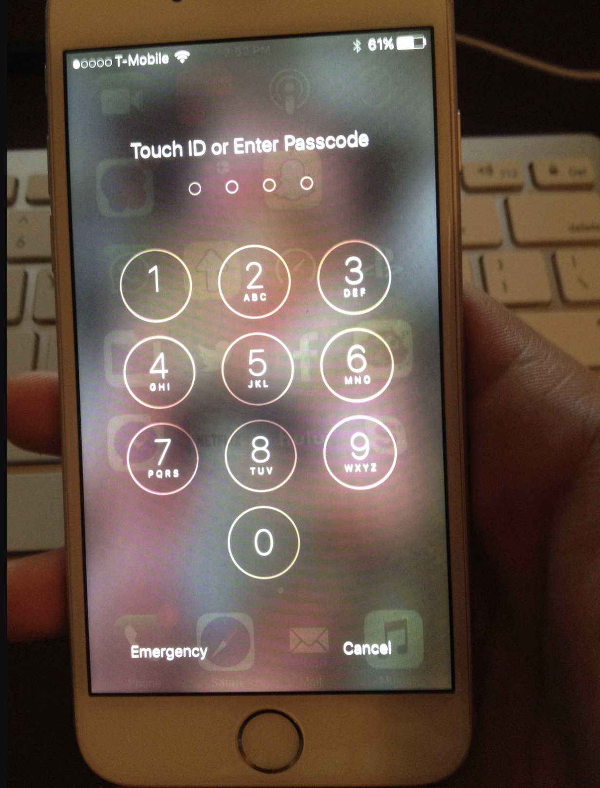 0000 TMobile Touch Id or Enter Passcode 1 4 Ohi 2 Lo 5 Jel 3 Dep Co 6 7 Fors 8 Tuv 9 Wxy 0 61% Emergency Cancel