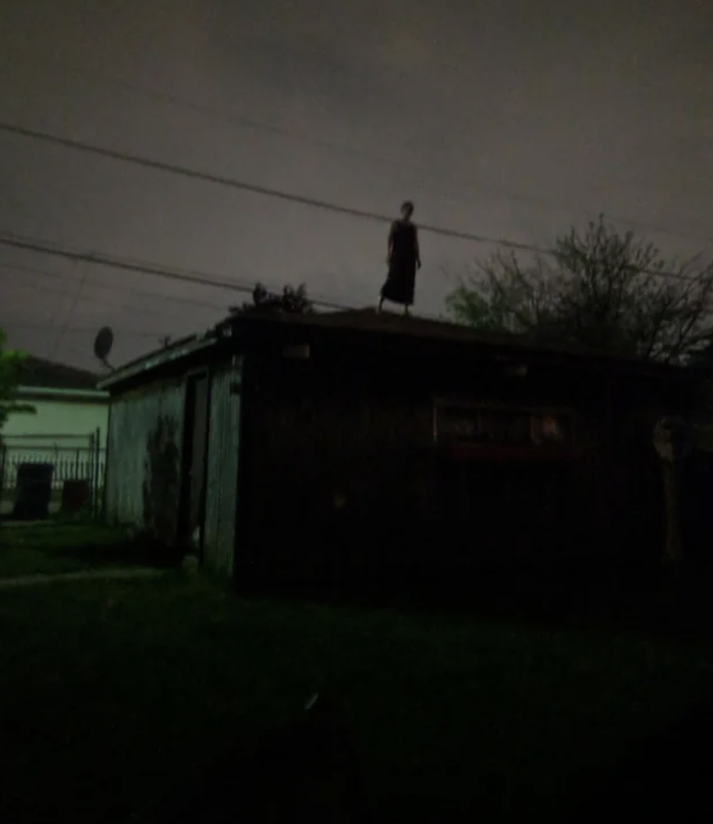 creepy lady standing on roof