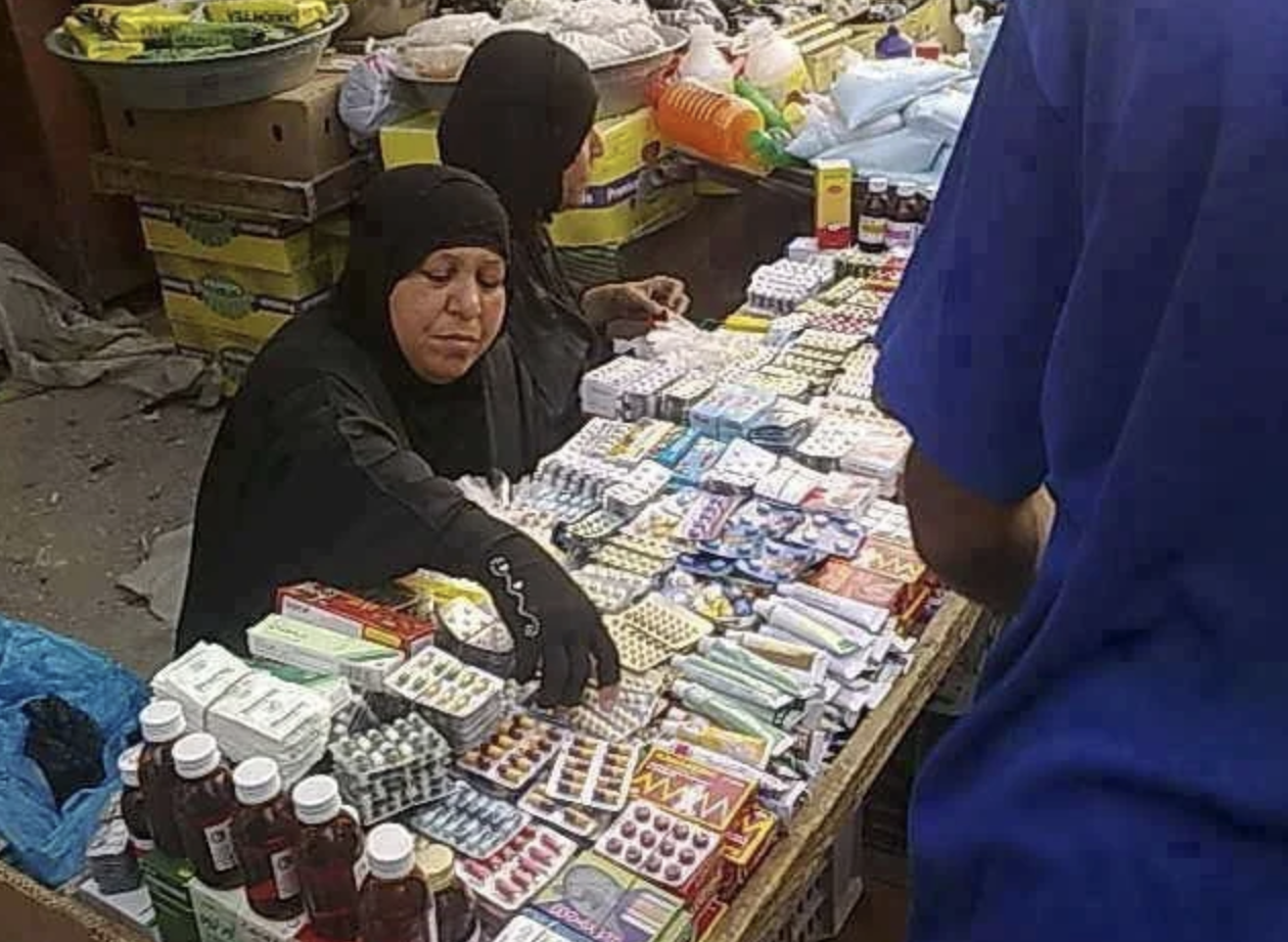 Iraqi street vendor selling prescription drugs on the street.