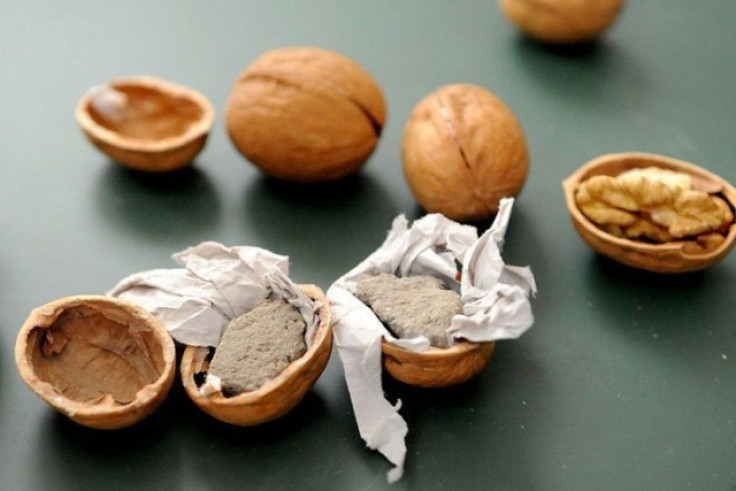 Chinese vendors caught selling fake walnuts. 