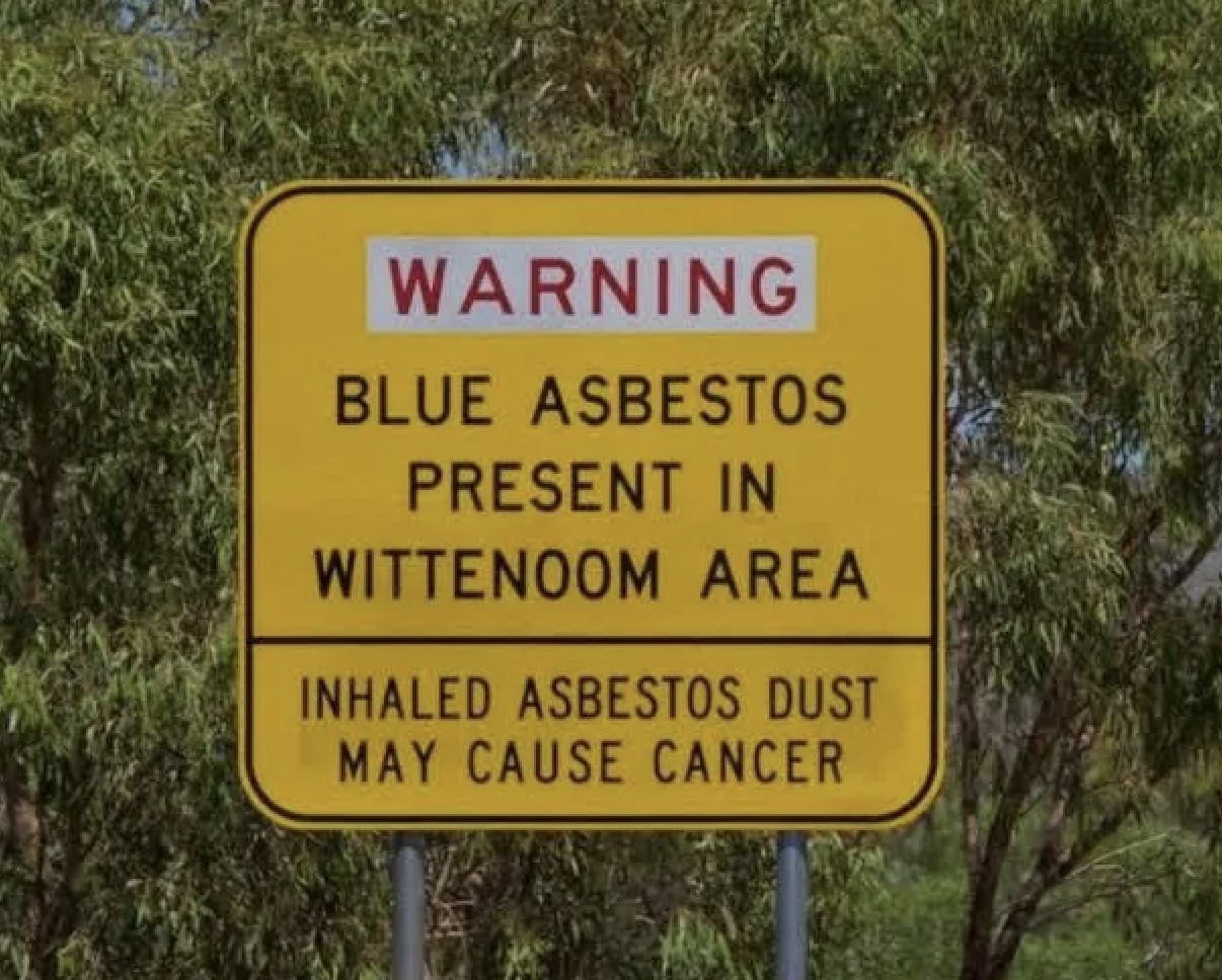 street sign - Warning Blue Asbestos Present In Wittenoom Area Inhaled Asbestos Dust May Cause Cancer