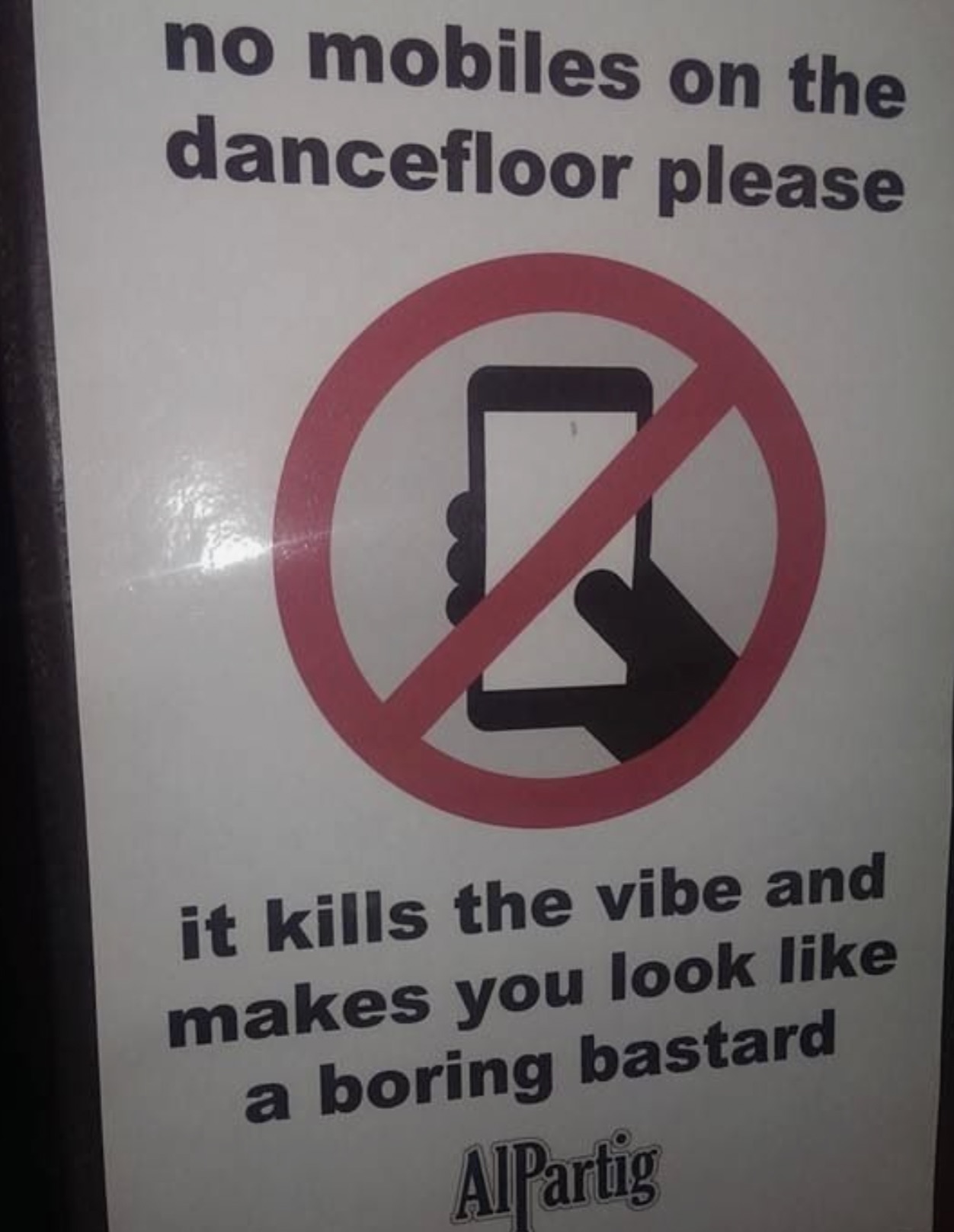 sign - no mobiles on the dancefloor please it kills the vibe and makes you look a boring bastard AlPartig