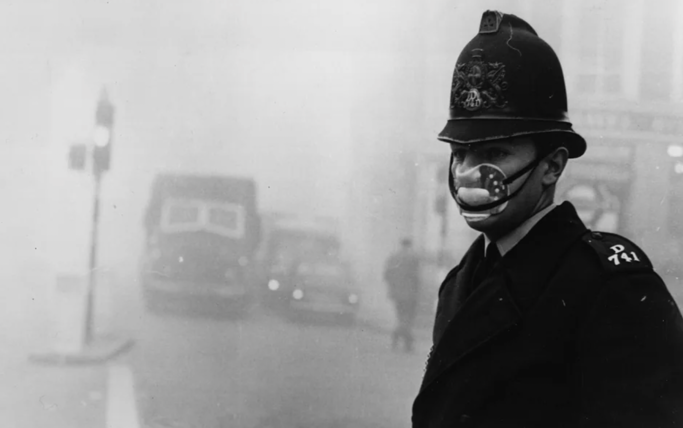 Police officer wearing a face mask during the London smog in 1952.