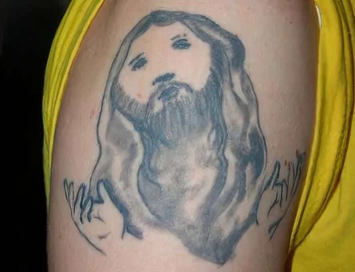 extremely bad tattoos - jesus right shoulder tattoo