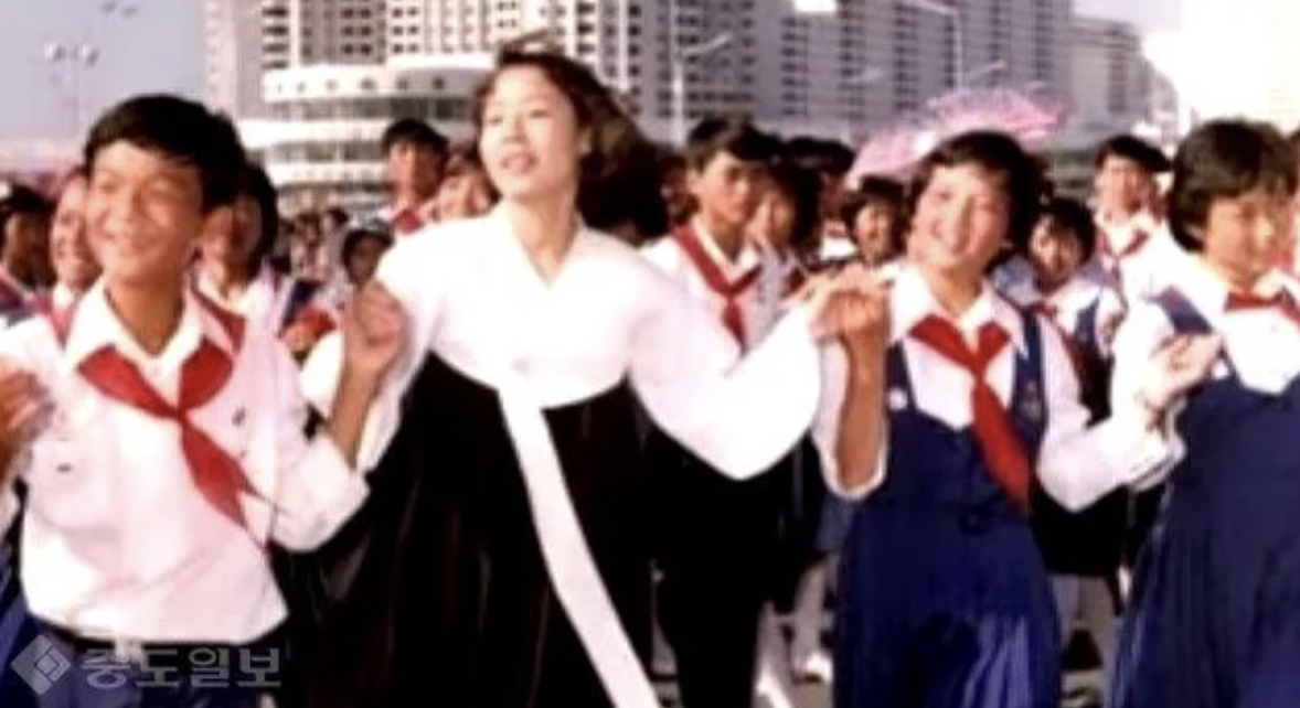 South Korean student activist Lim Su-kyung dancing with North Korean students during her illegal visit to DPRK. Pyeongyang, 1989.