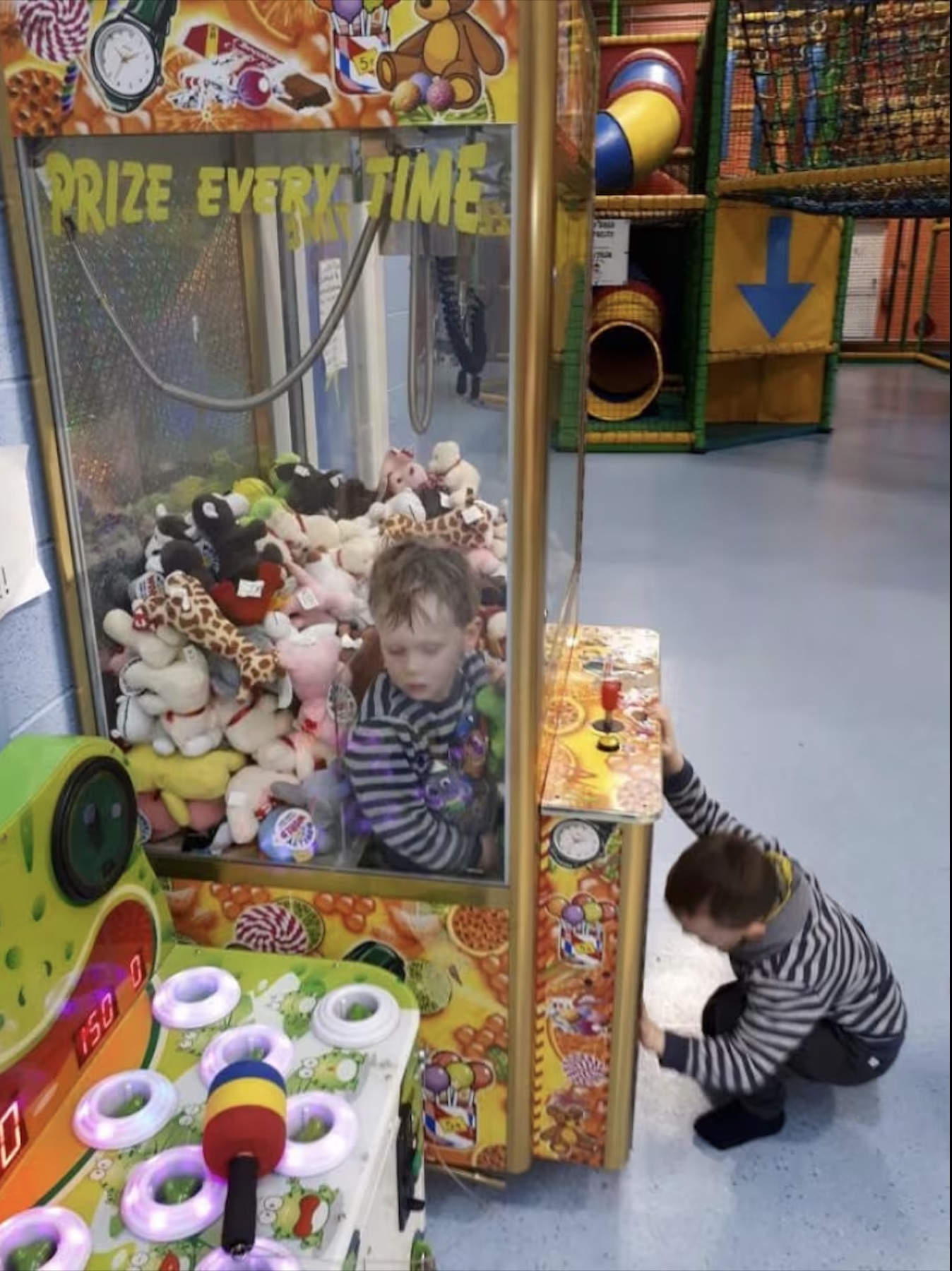 kid in claw machine - Prize Every Time 051