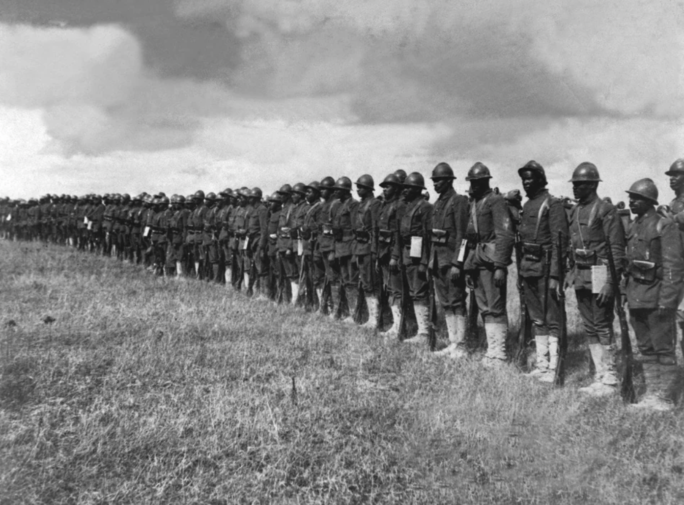 Soldiers of the 369th standing in line on the Western Front, 1917.