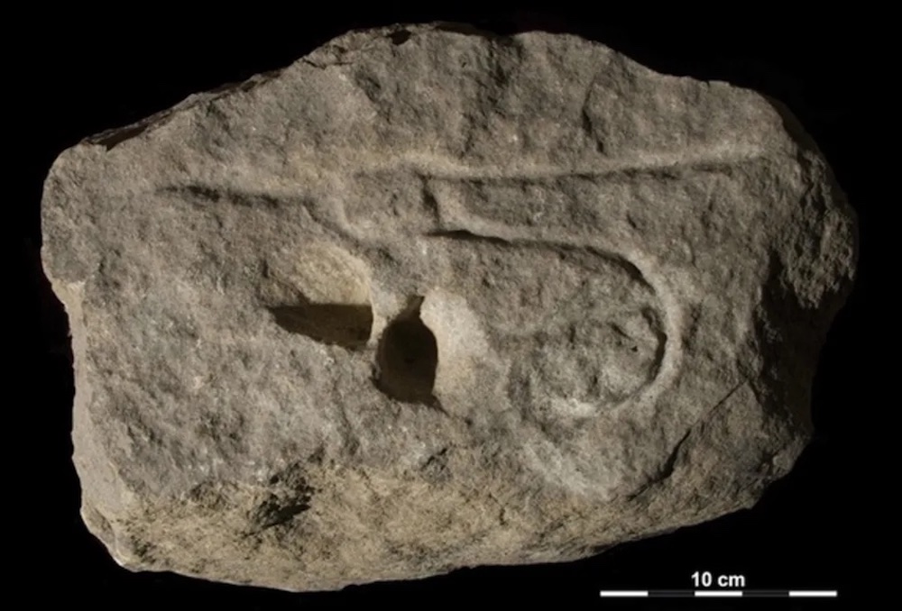 Female genital rock carving