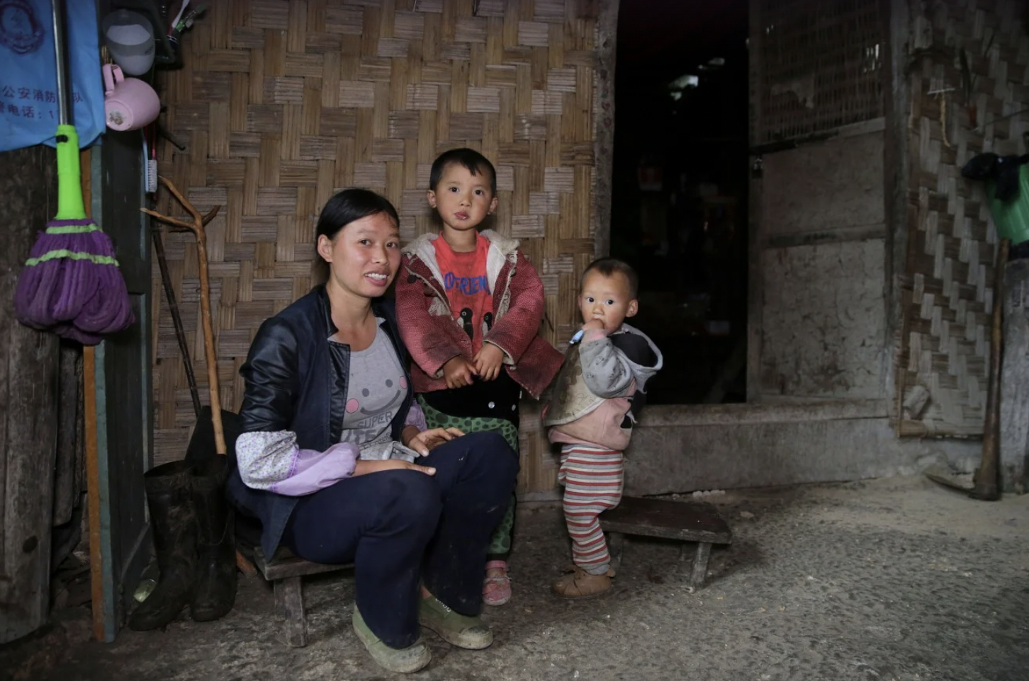 “Wu Baozhen with her children. She is one of the village’s few young parents.”