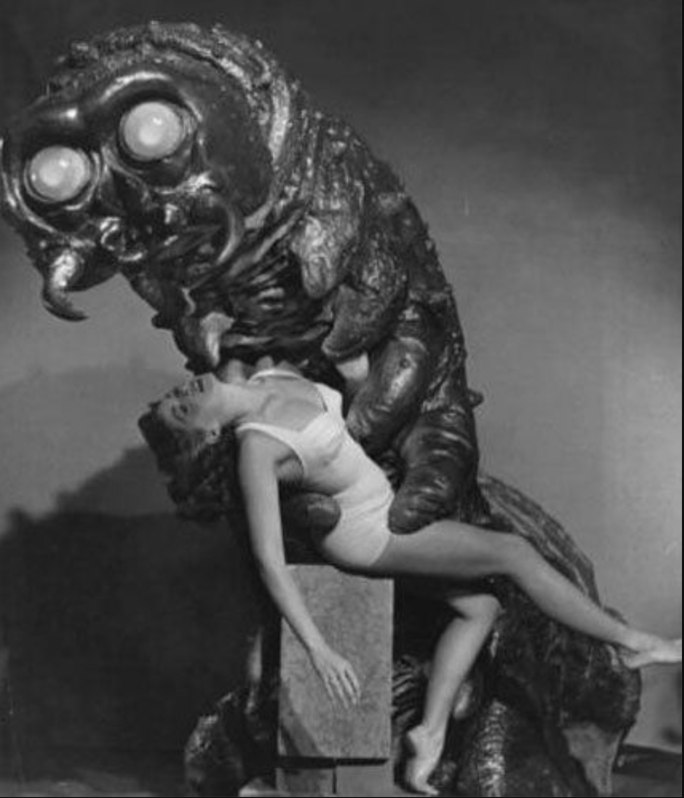 monster carrying woman