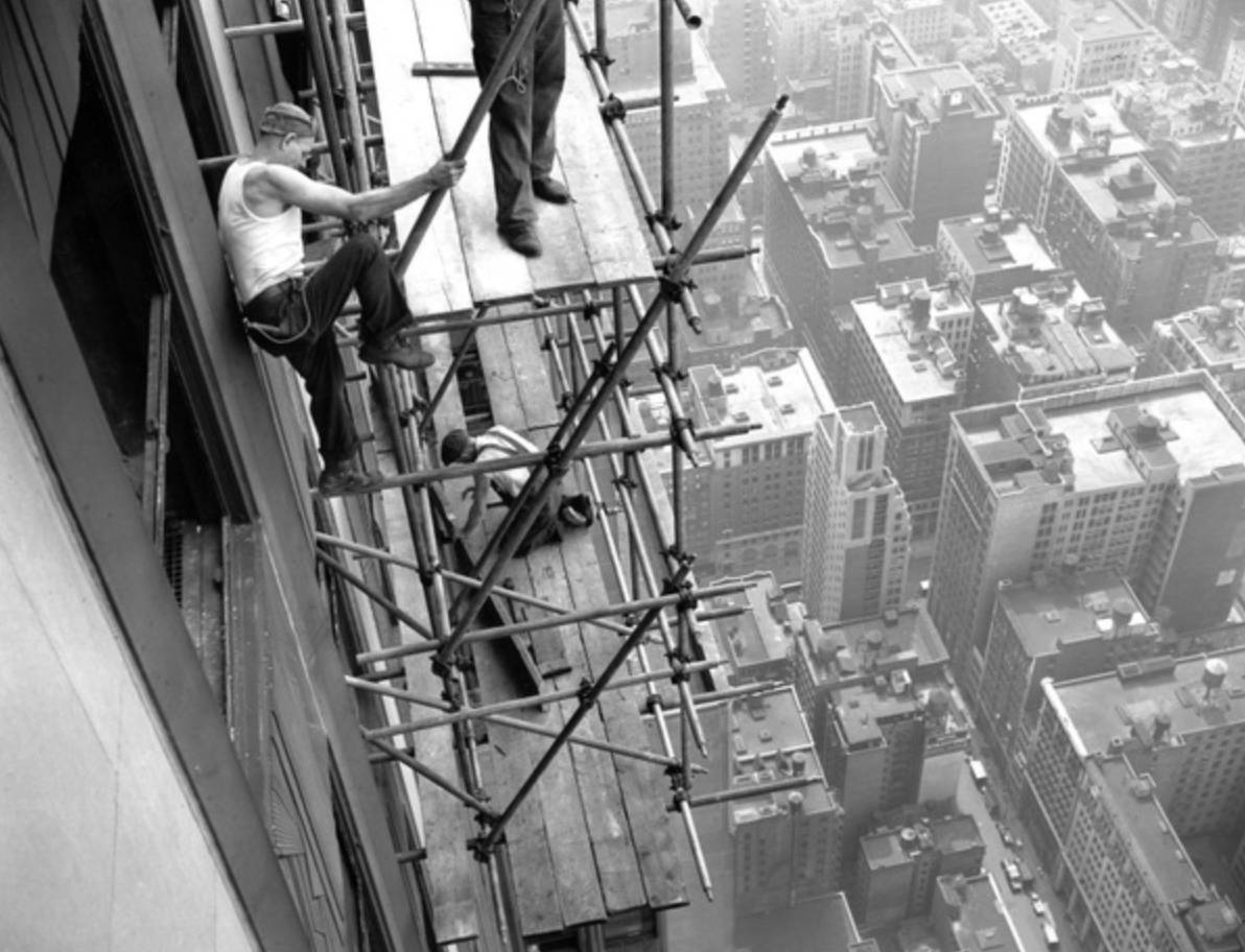 Repair workers fixing the damage to the north side of the Empire State building after the crash.