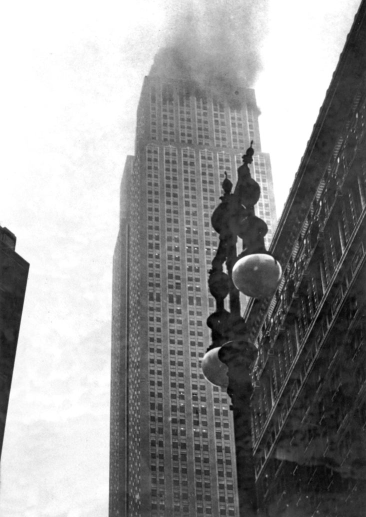 The Empire State Building ablaze after the B-25 bomber crashed into it in thick fog.