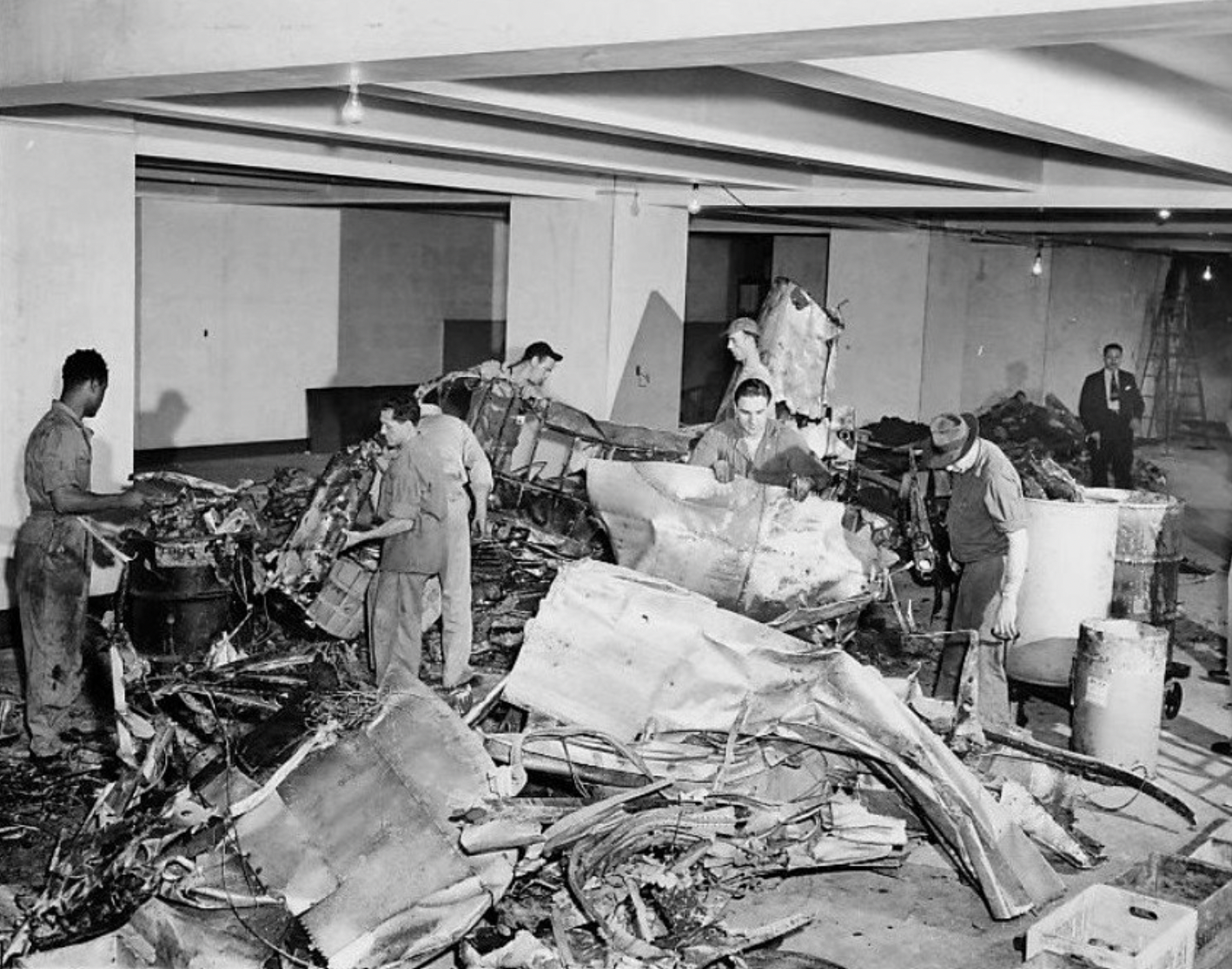 Workmen clearing the wreckage.