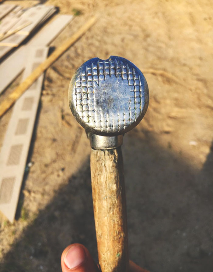 A construction worker's hammer worn down over time, and just look at the precision and accuracy he has.