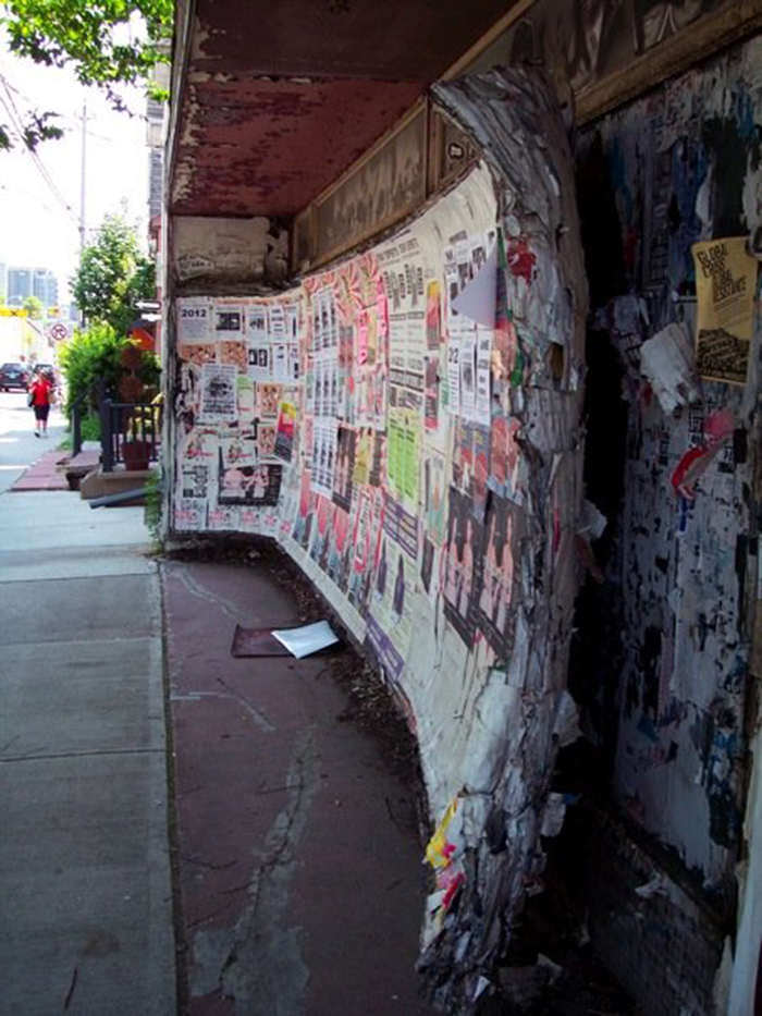 Decades of posters, flyers, and advertisements on this wall have become a wall of their own.