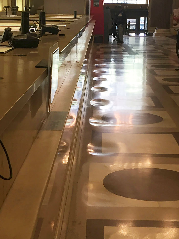 Thousands of customers at this bank over the years have worn down the floor in front of the teller windows.