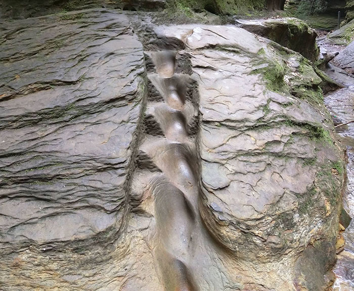 The way water runs down the face of this rock has created a natural set of 'steps'.