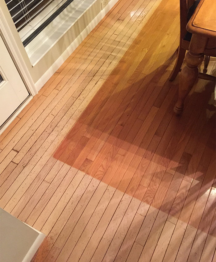 The area rug in this family's dining room has kept the floor underneath it in pristine condition.