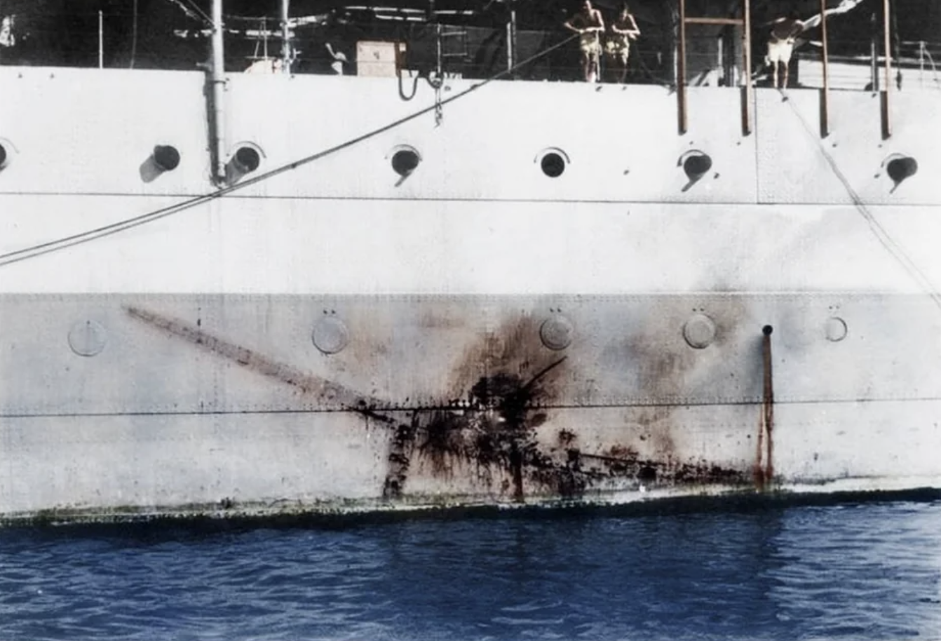 Imprint of a Mitsubishi Ki-51 kamikaze along the side of H.M.S Sussex. 1945. 