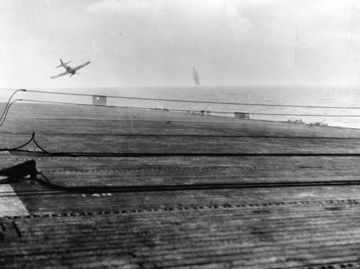 An airman in a Mitsubishi A6M5 Model 52 "Zero" just before an attempted Kamikaze strike on the carrier USS White Plains.