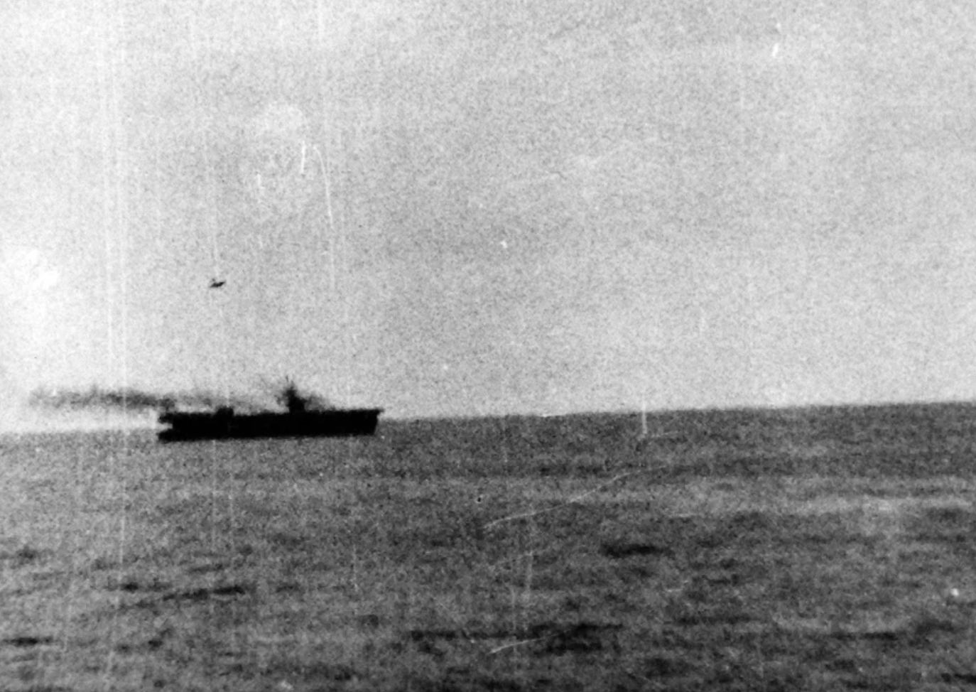 A Japanese Mitsubishi A6M Zero kamikaze is photographed diving onto USS Marcus Island, 1944. 