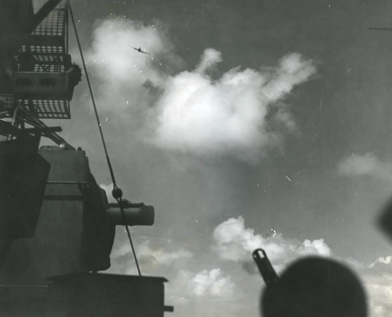 A Mitsubishi A6M Zero special attack aircraft diving for a Kamikaze attack on the carrier Lexington off the Philippines, 5 November 1944.