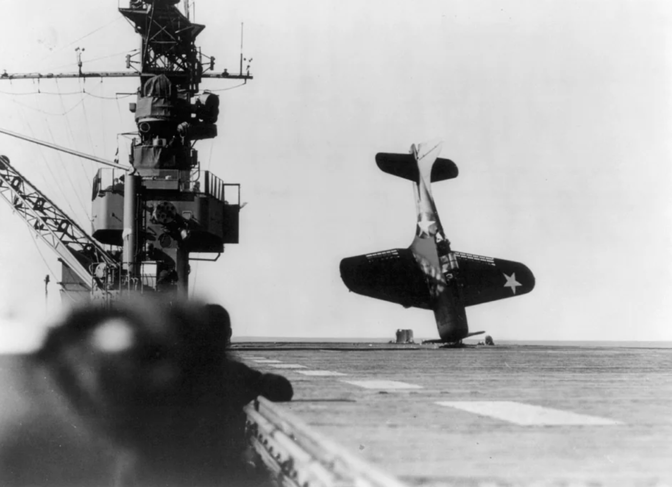 SBD Dive Bomber Dauntless teeters on the nose on the flight deck of USS Cabot, June, 1943. 