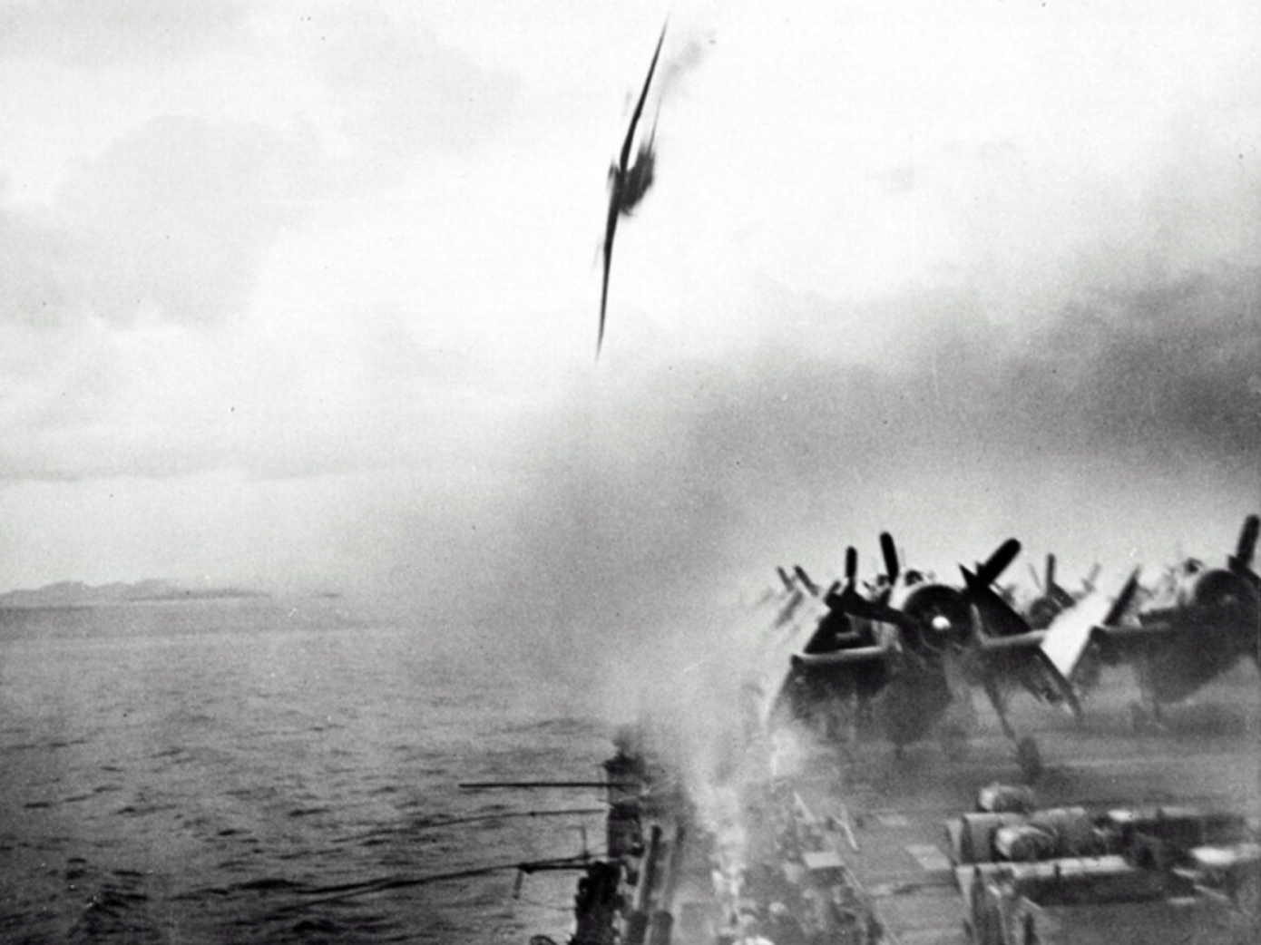 A Kawasaki Ki-61 makes its final dive for the USS Sangamon, it would miss the deck and only take out a few antennas. Half an hour later a Ki-45 would slam into her deck killing 11. 4th of May, 1945.