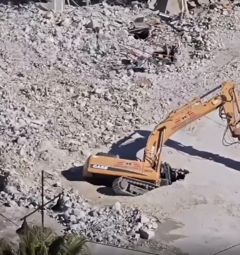 Excavator goes through the floor. Fuengirola, Spain.