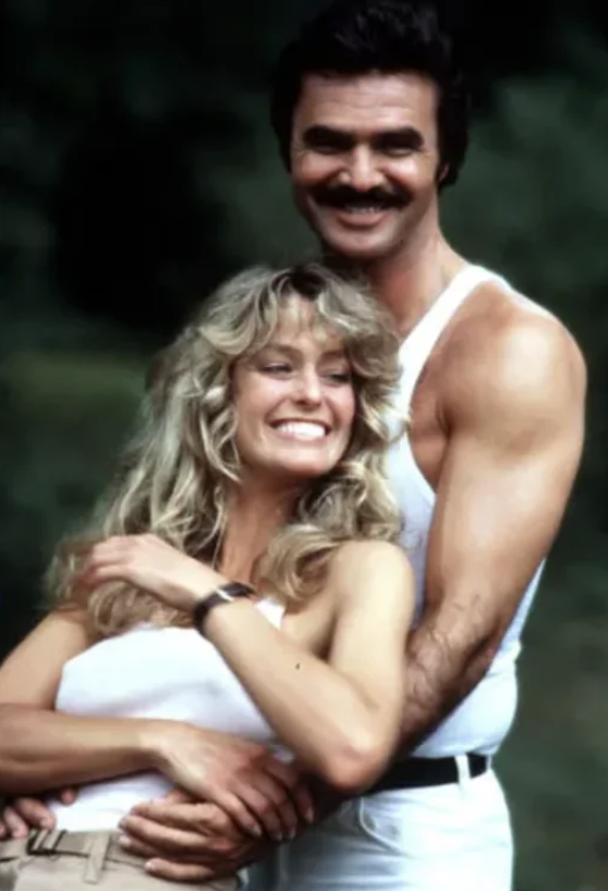 Farrah Fawcett with Burt Reynolds during filming. 