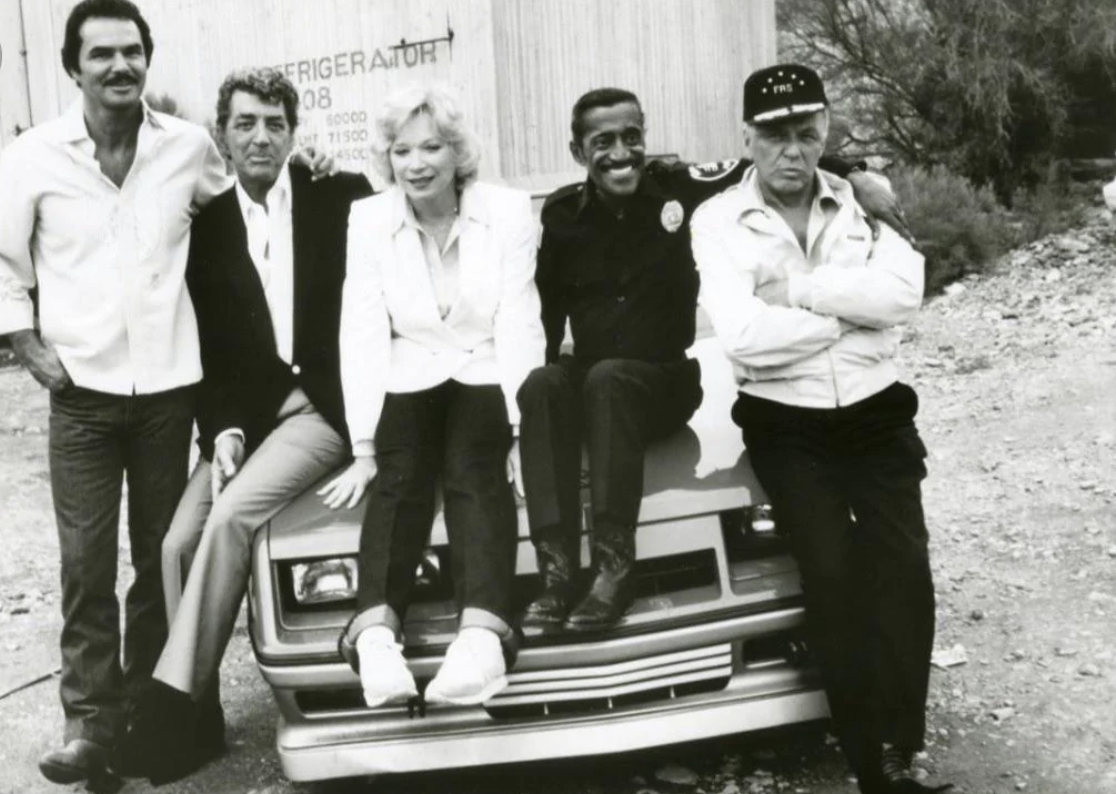 Burt Reynolds, Dean Martin, Shirley MacLaine, Sammy Davis Jr., Frank Sinatra on the set of Cannonball Run II (1984).