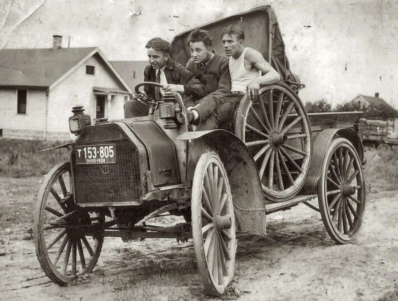 Three friends take a joyride on their "new" car, Ohio, circa 1924.