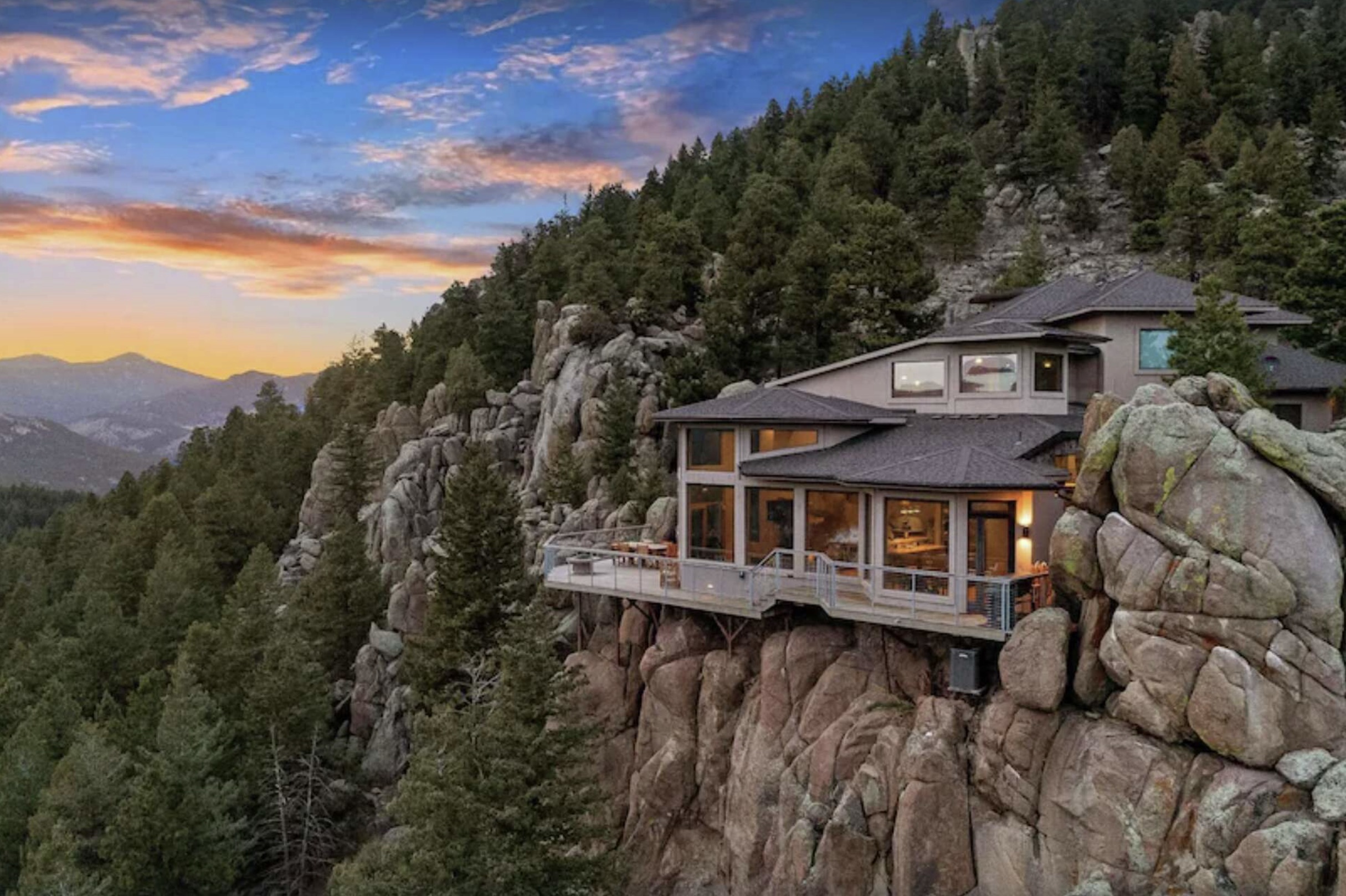 house on edge of mountain