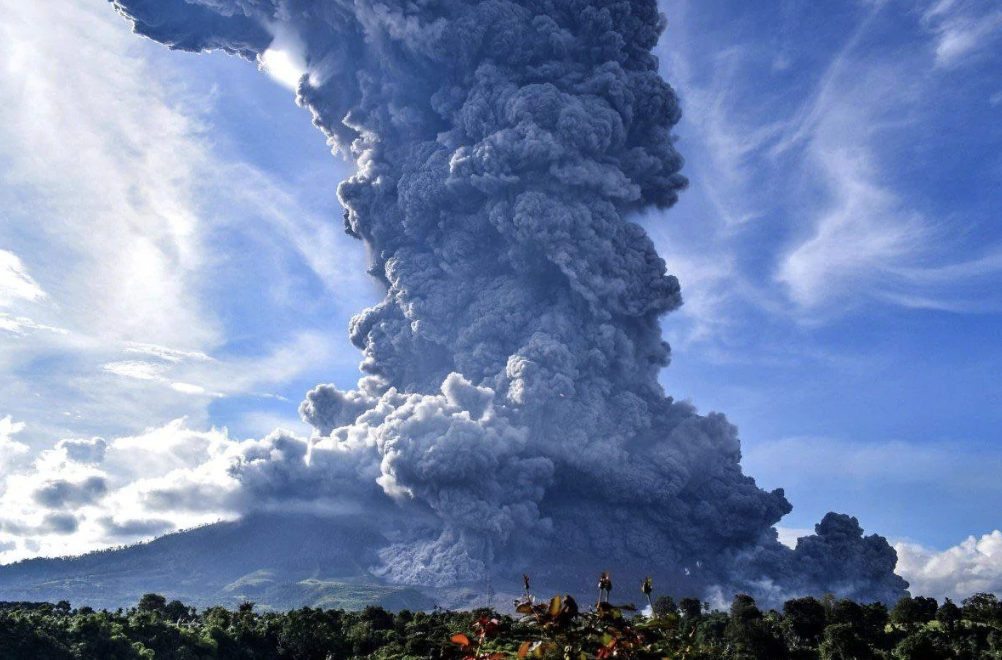 Ash plume more than three miles high.