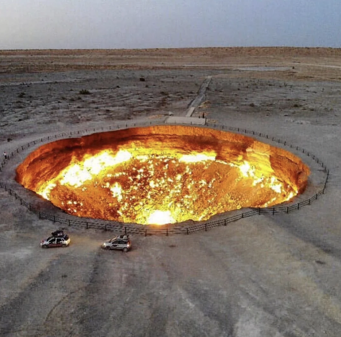 The Darvaza gas crater is a burning natural gas field collapsed into a cavern near Darvaza, Turkmenistan. It is 230 feet wide, and has been burning since 1971.