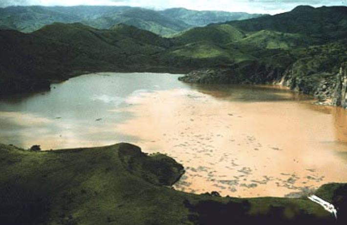 Lake Nyos is a crater lake in the Northwest Region of Cameroon. The lake has been known to have lethal limnic eruptions, and in 1986, an unexpected launch of carbon dioxide from the lake suffocated almost 2,000 people, and plenty of livestock. The risk of another eruption is imminent. 