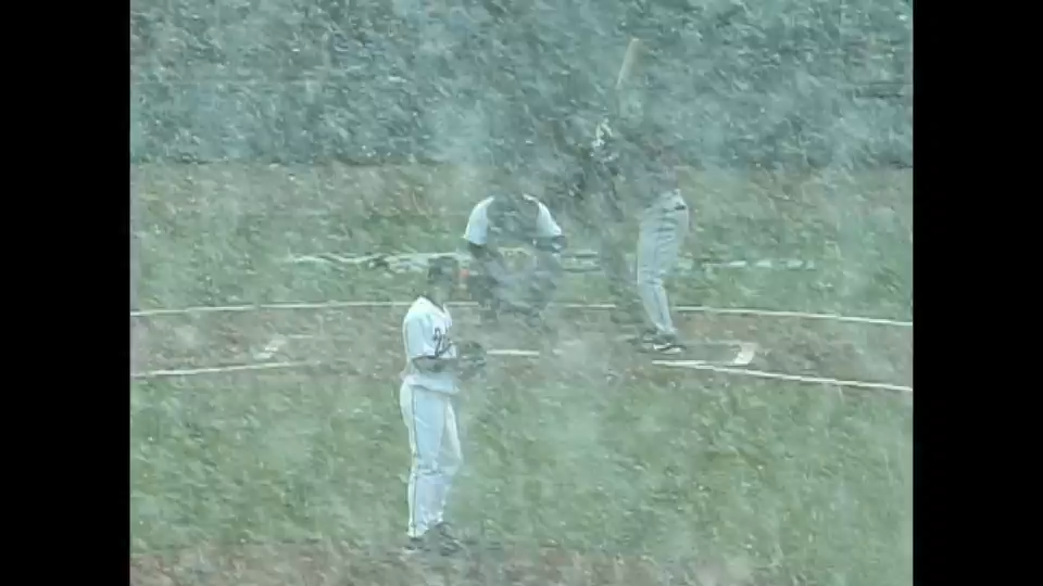 Moments before Ellis Burks hits a flyball, which is dropped in the snow in Baltimore, on opening day in 2003.