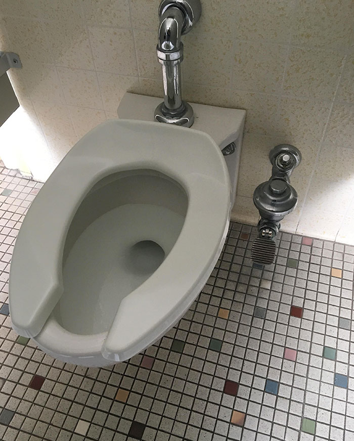 This school has pedals to flush the toilet so you don't have to use your hands.