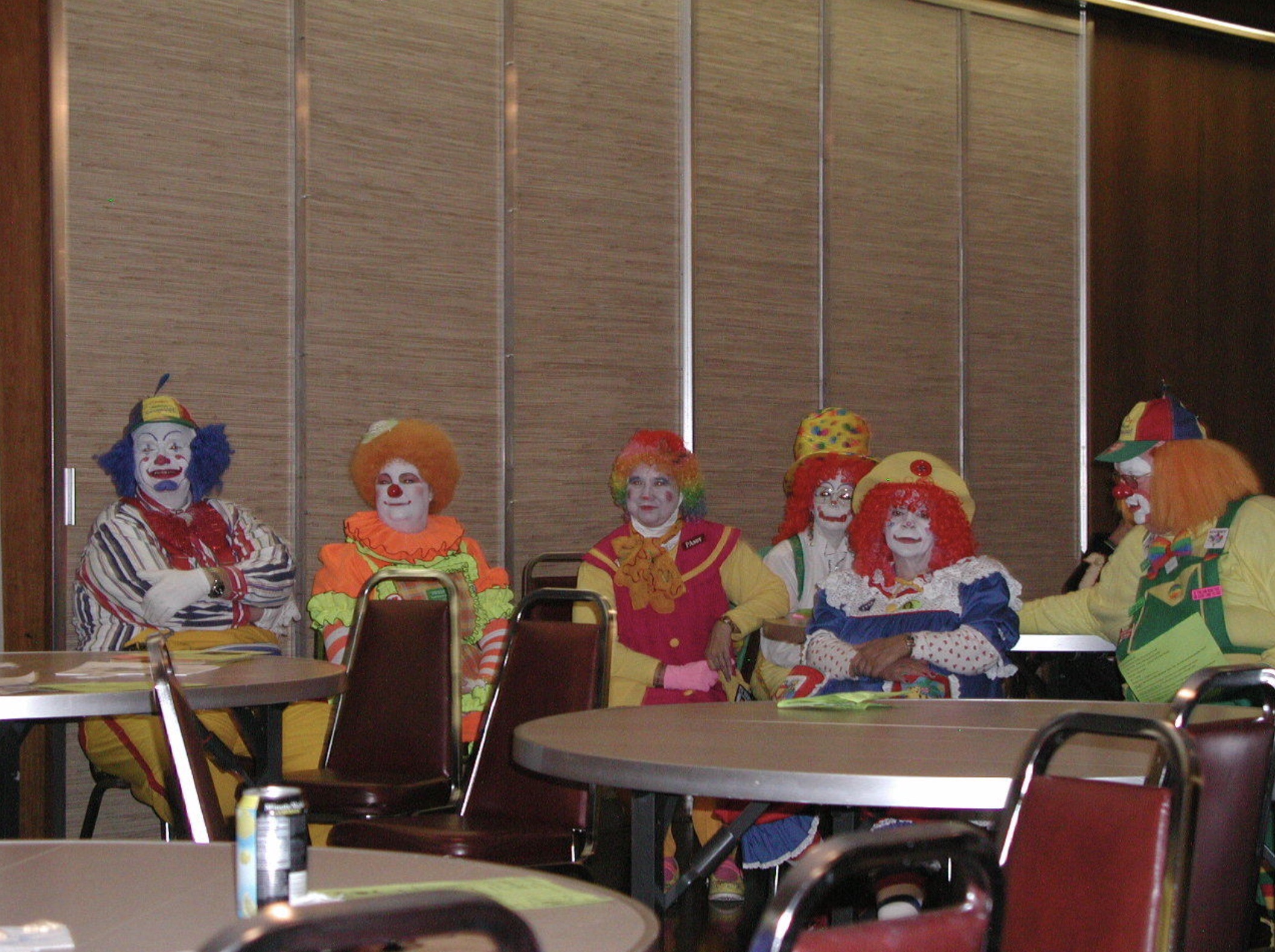 clowns sitting at a table