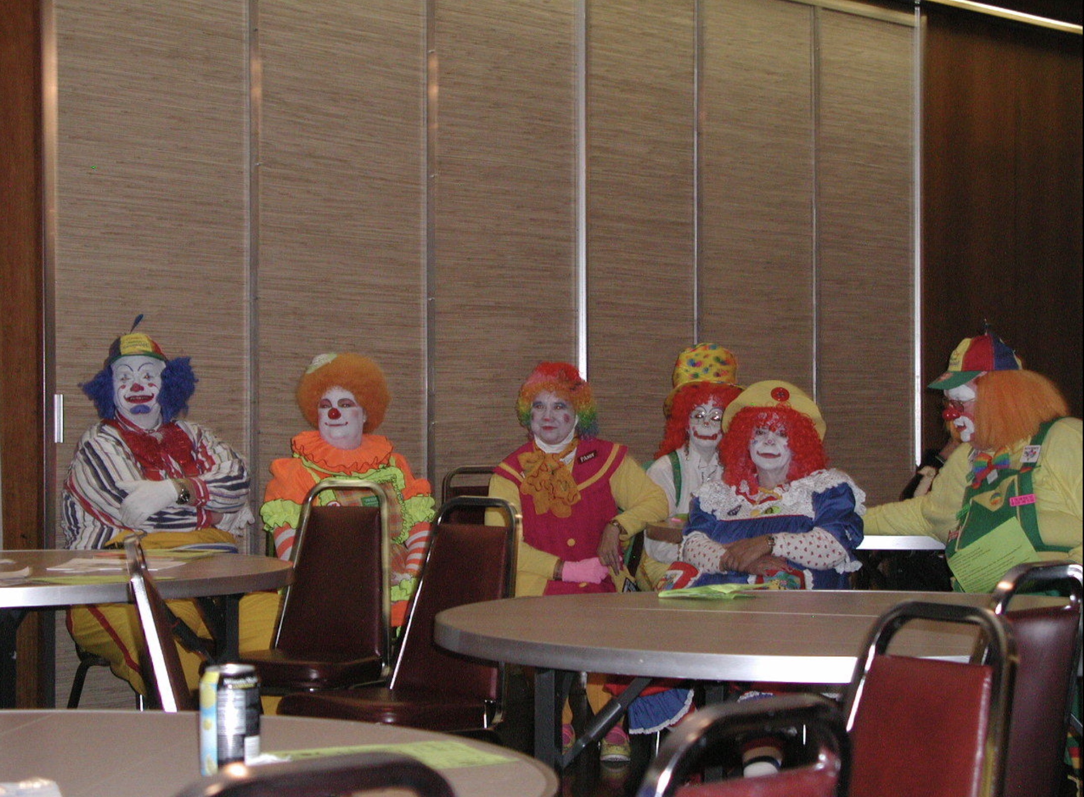 clowns sitting at a table